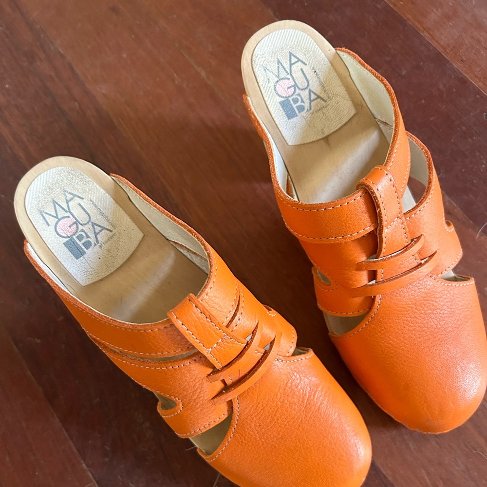 Maguba size 40 orange clogs.